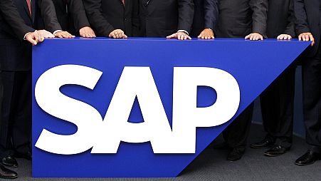 In this July 31, 2008 file picture the board members of German software company SAP are seen behind the company logo at it's headquarter in Walldorf near Heidelberg.