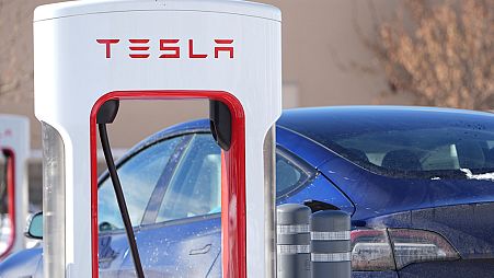 Motorists recharge their Tesla vehicles at a Tesla supercharging location Tuesday, Jan. 16, 2024, in northeast Denver.